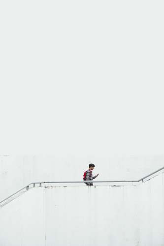 itb international relation office man on stair wearing red backpack indonesia
